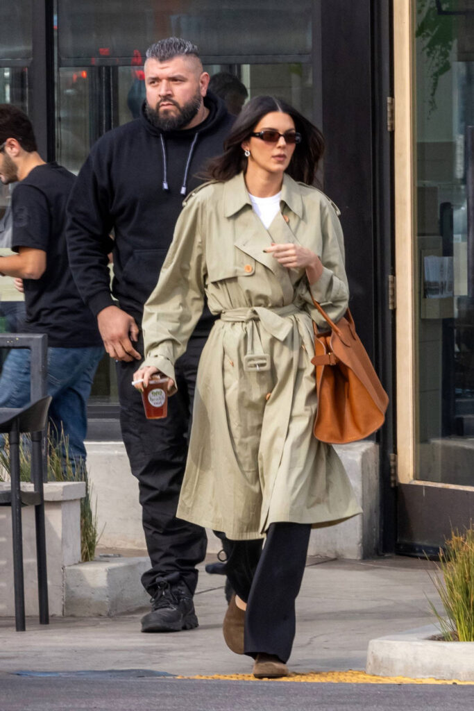 Kendall Jenner with “June Double-Breasted Belted Trench Coat” and “Soft Margaux 15 Bag” (2023)